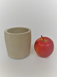 Concrete pot and apple