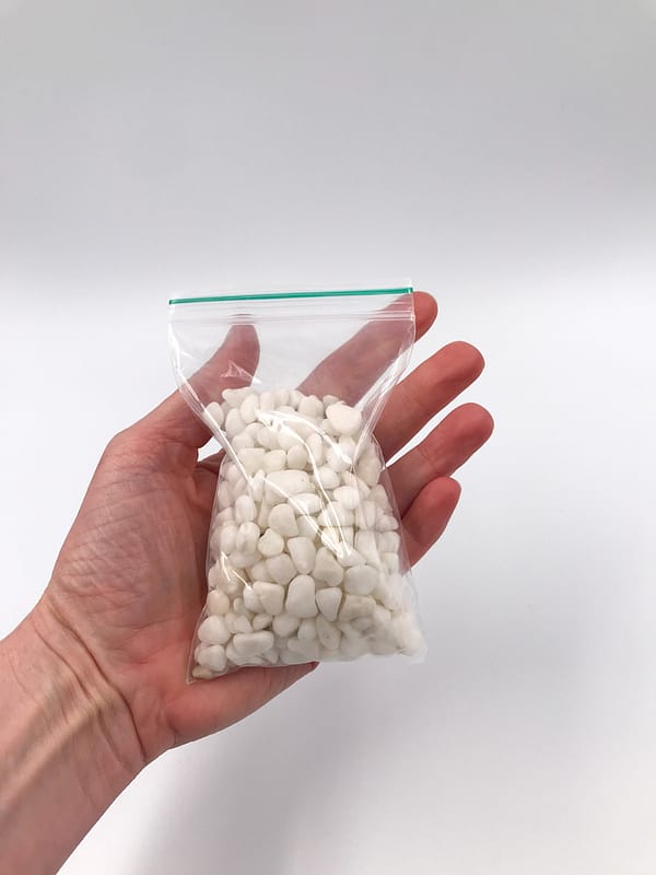 White terrarium gravel in a bag